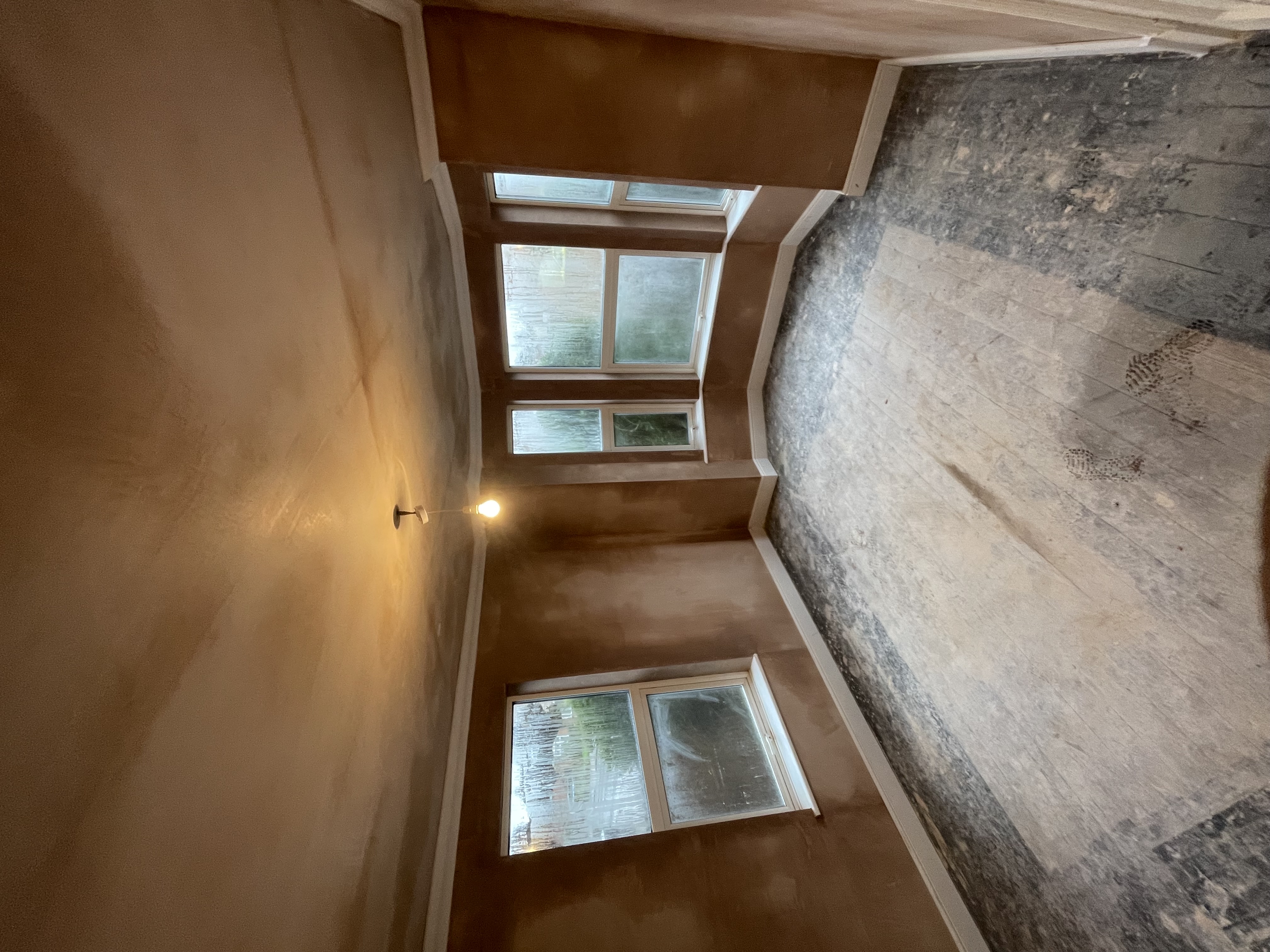Period bay window room with fresh specialist plaster on all walls ready for decoration