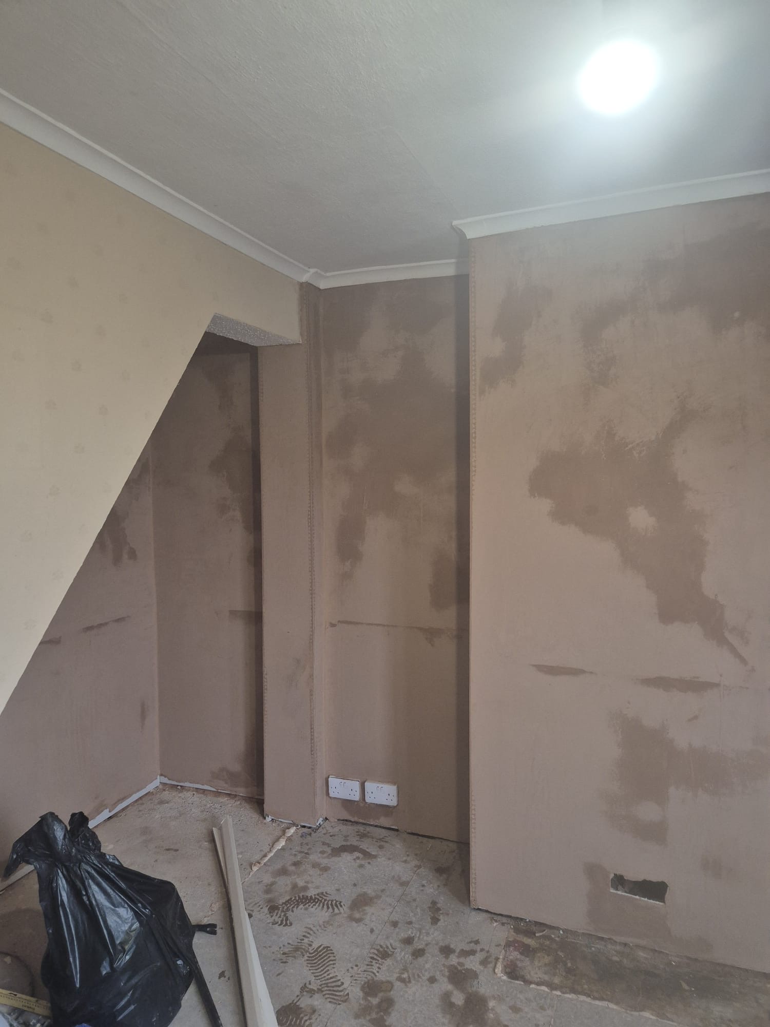 Multi-wall replastering in progress after damp proofing treatment