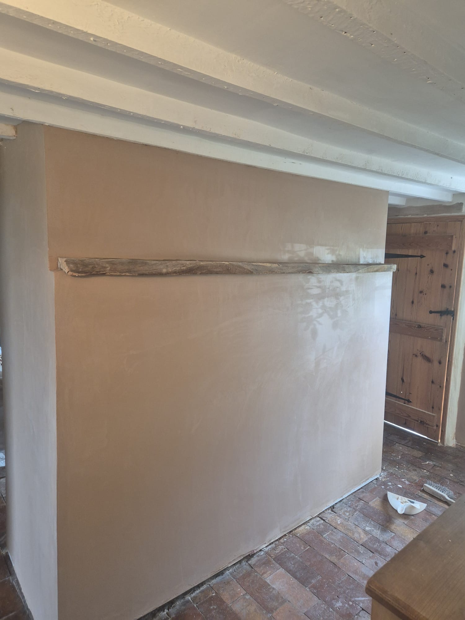 Fresh specialist plaster applied after rising damp treatment