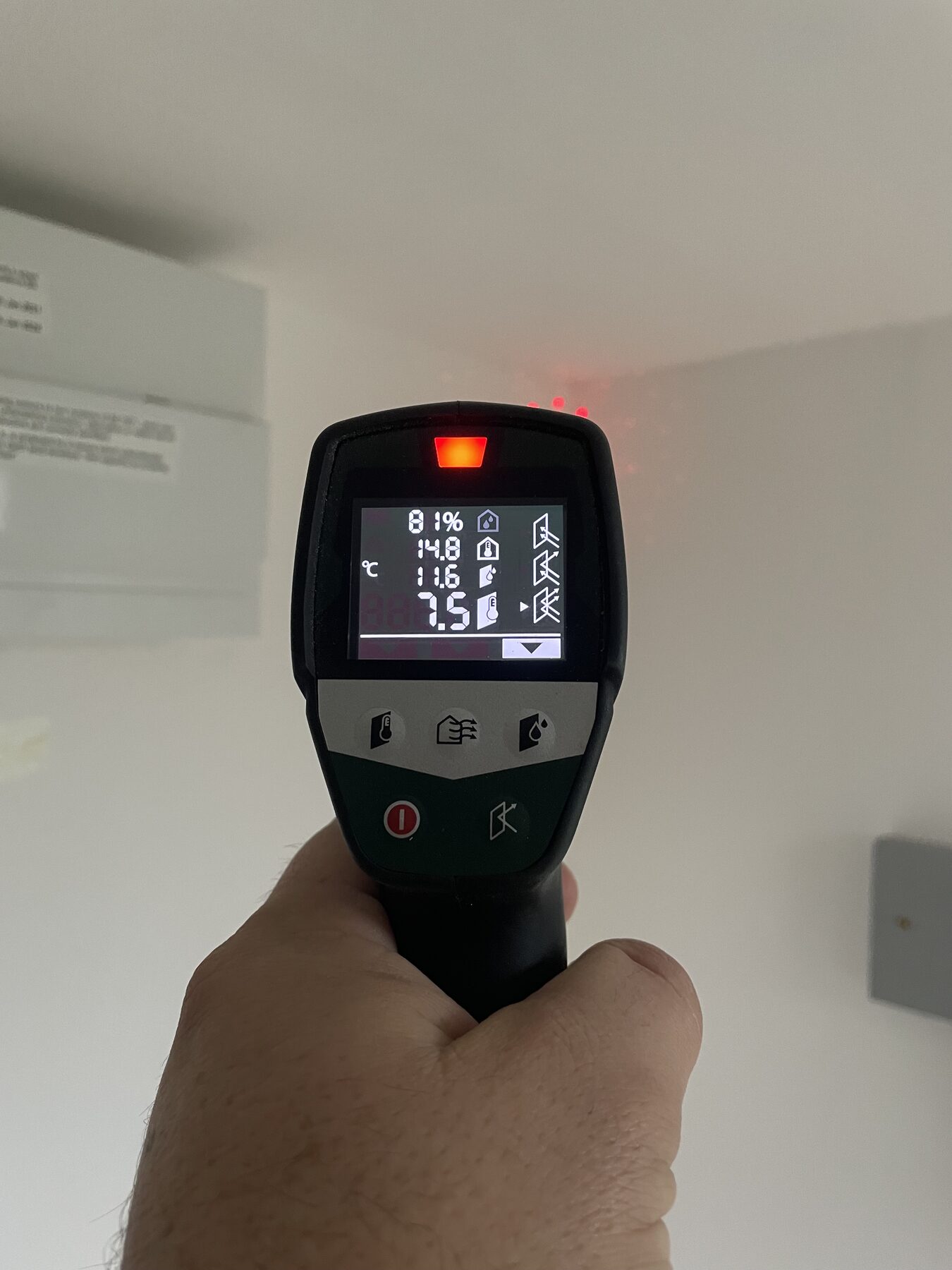 Thermal and humidity meter being used during a professional damp inspection