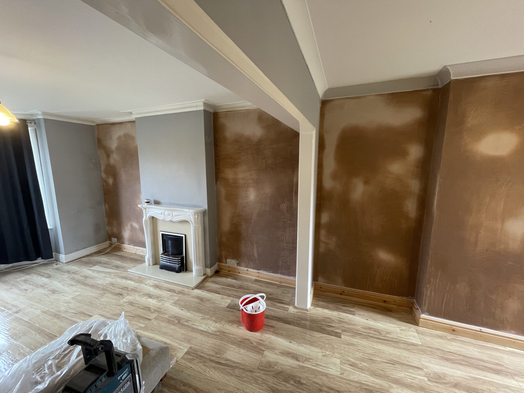 Living room fully replastered after damp proofing — ready for decoration