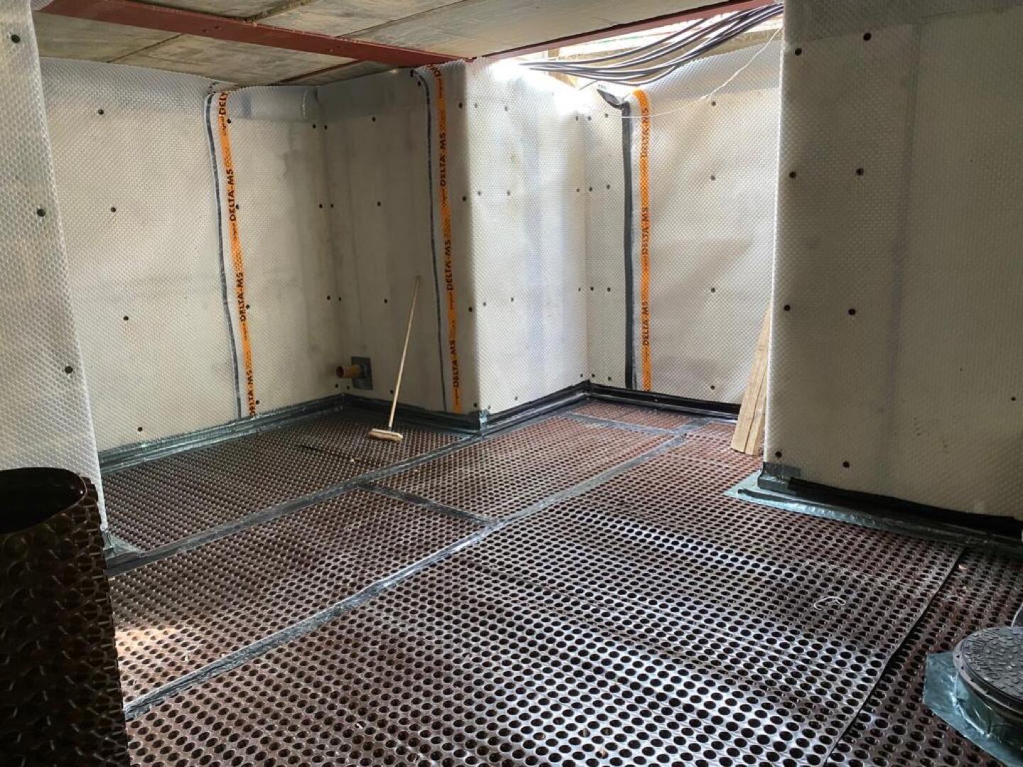 Basement waterproofing floor membrane installation