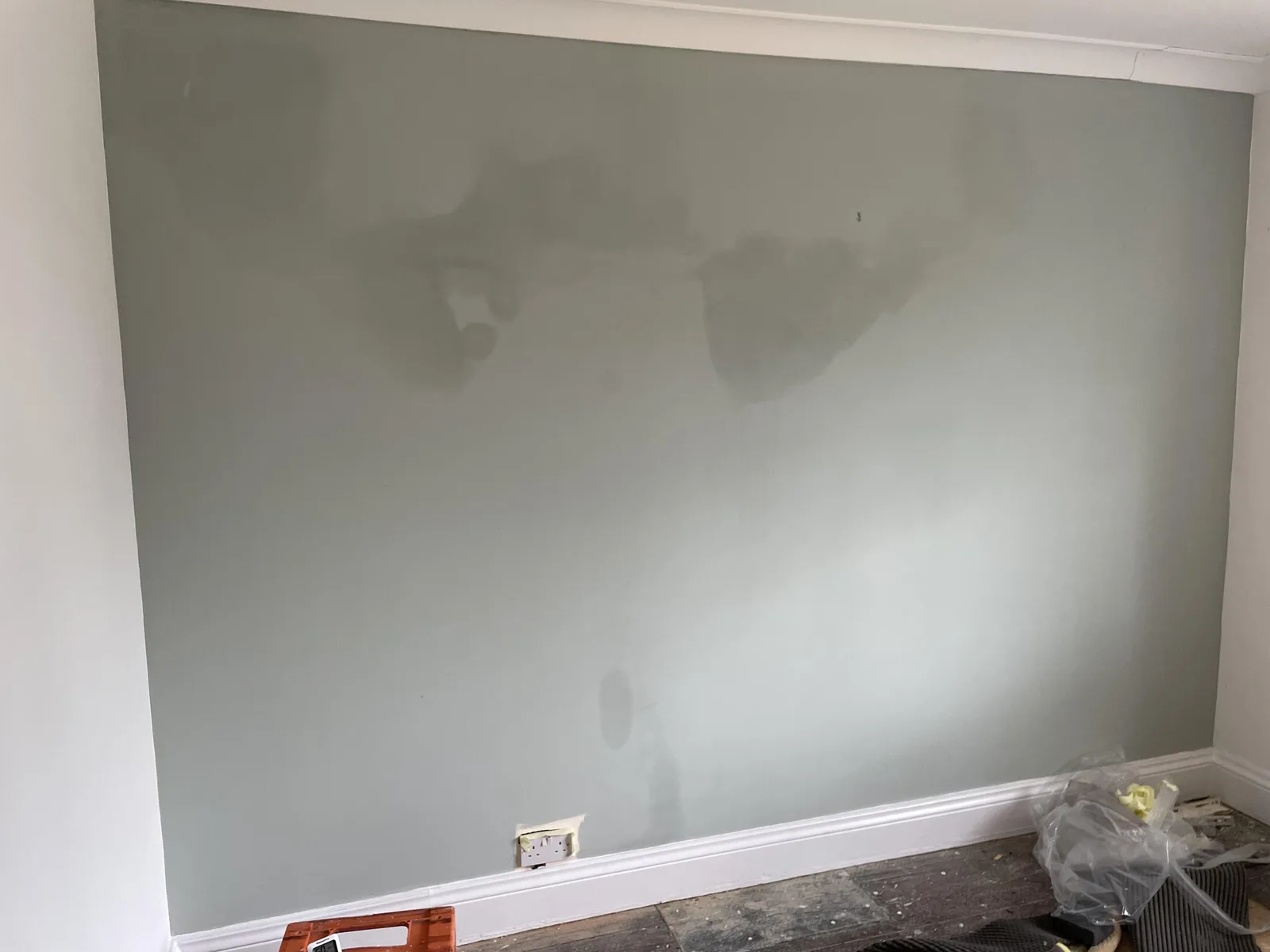 Hygroscopic salt staining on chimney breast wall